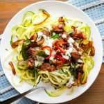 Low Carb Philly Cheesesteak Zoodles topped with onions and hot peppers