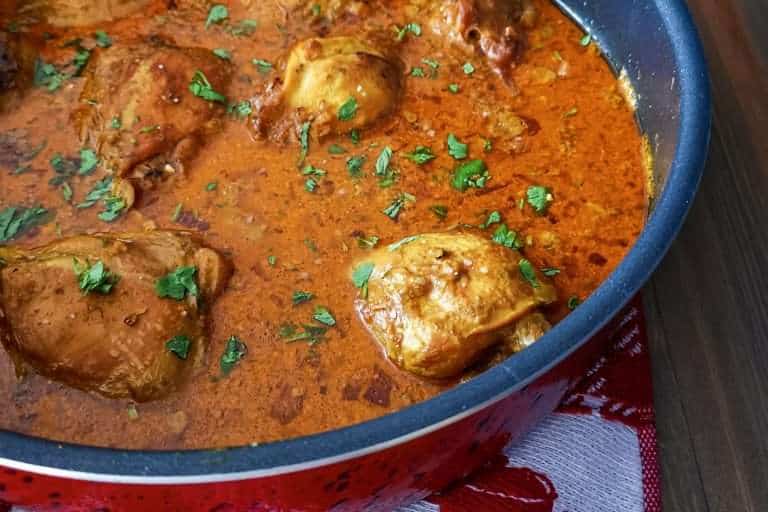 Keto friendly Indian chicken curry in a red pot