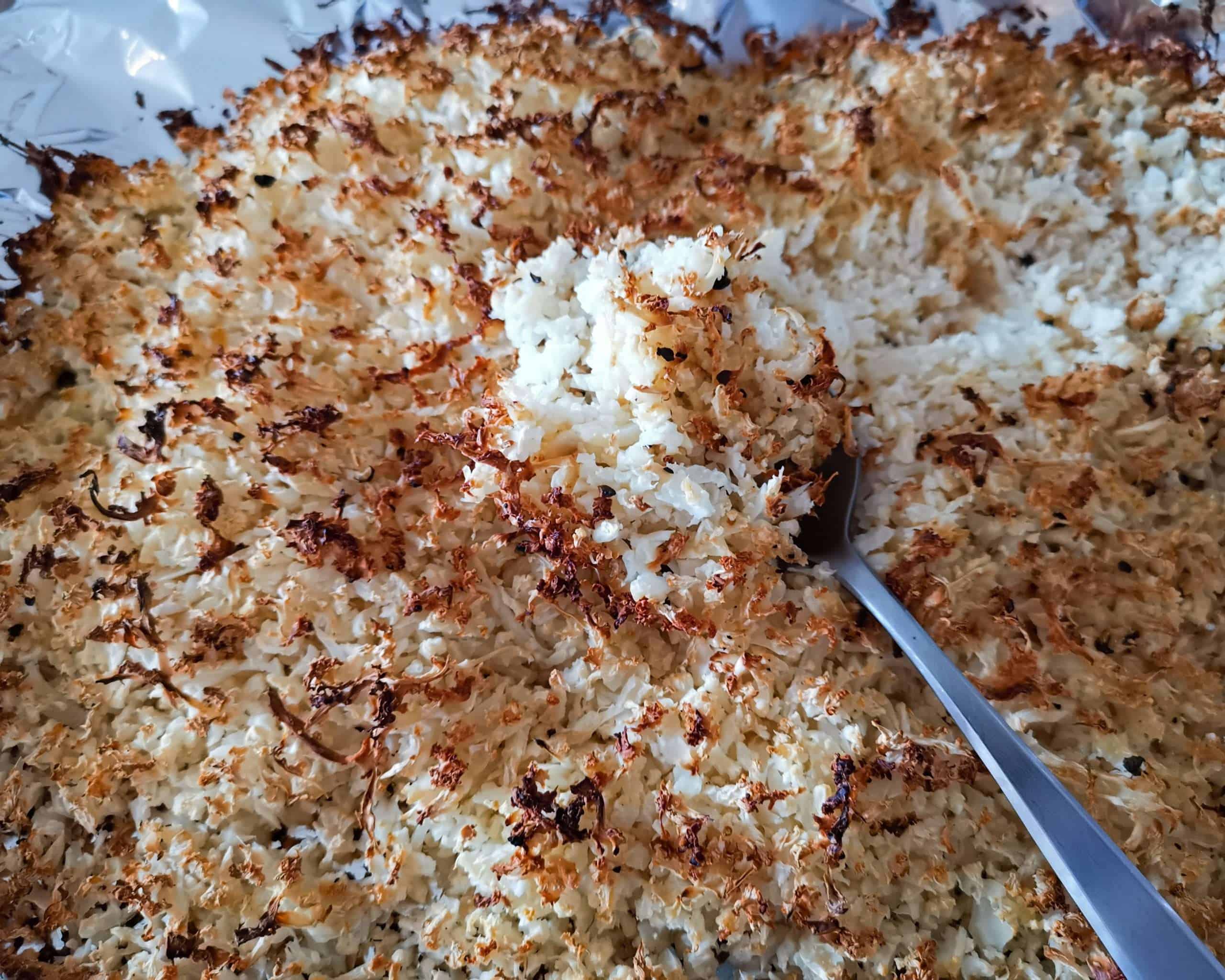 Oven Roasted Cauliflower rice on a baking sheet