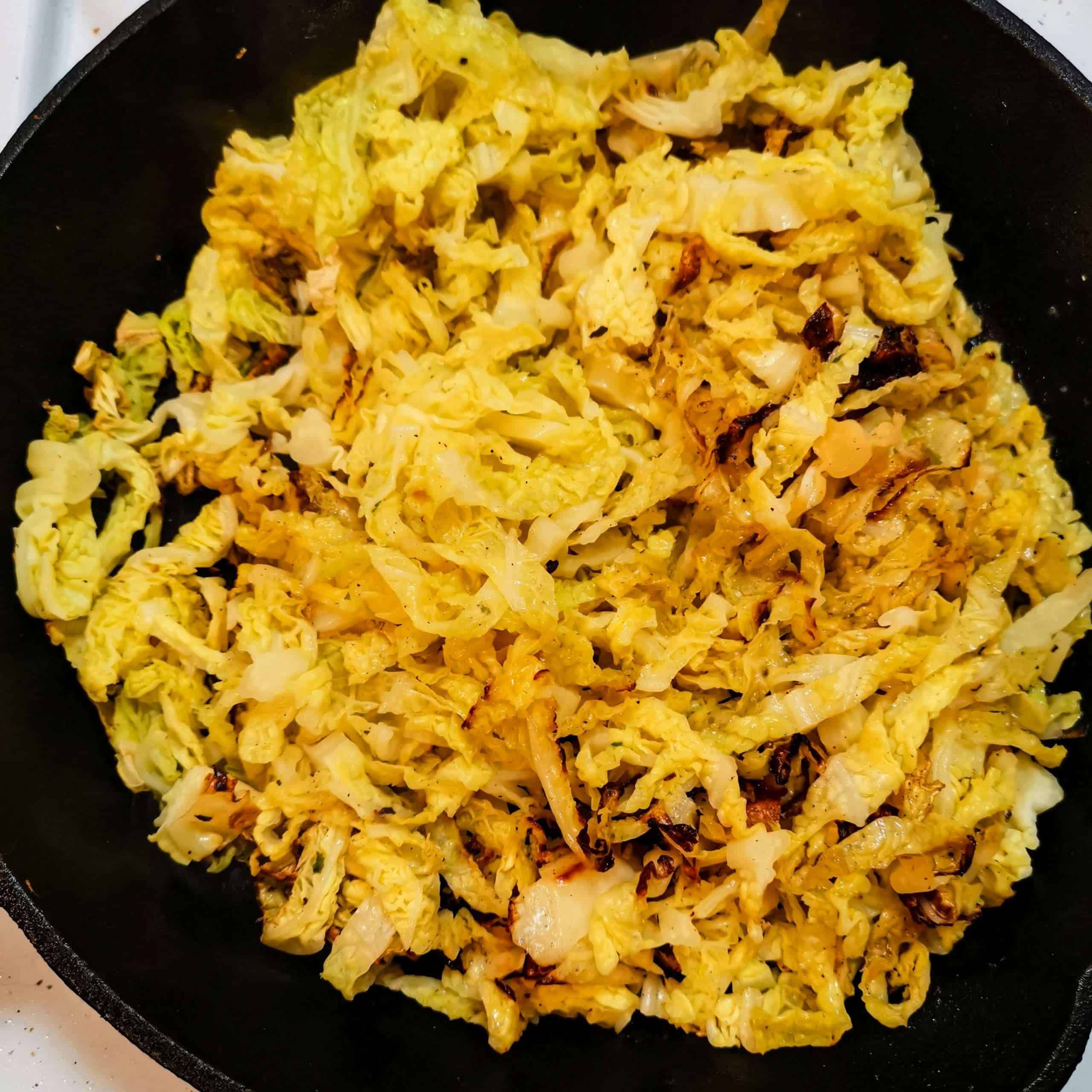 Savoy cabbage noodles in a skillet with butter