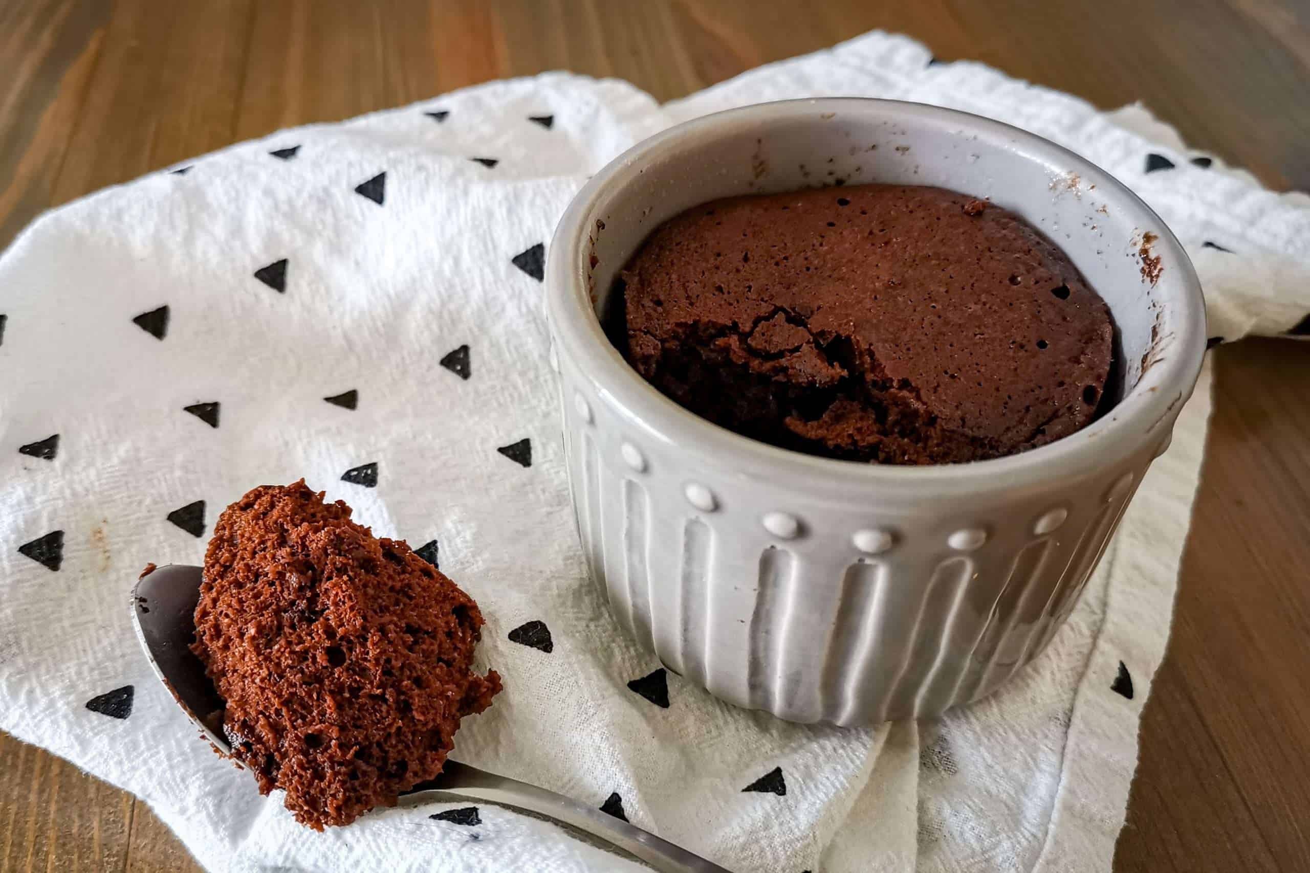 Keto mug brownie with a bite out of it