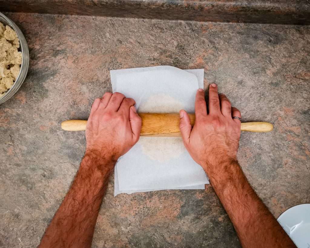 Keto tortilla dough being rolled