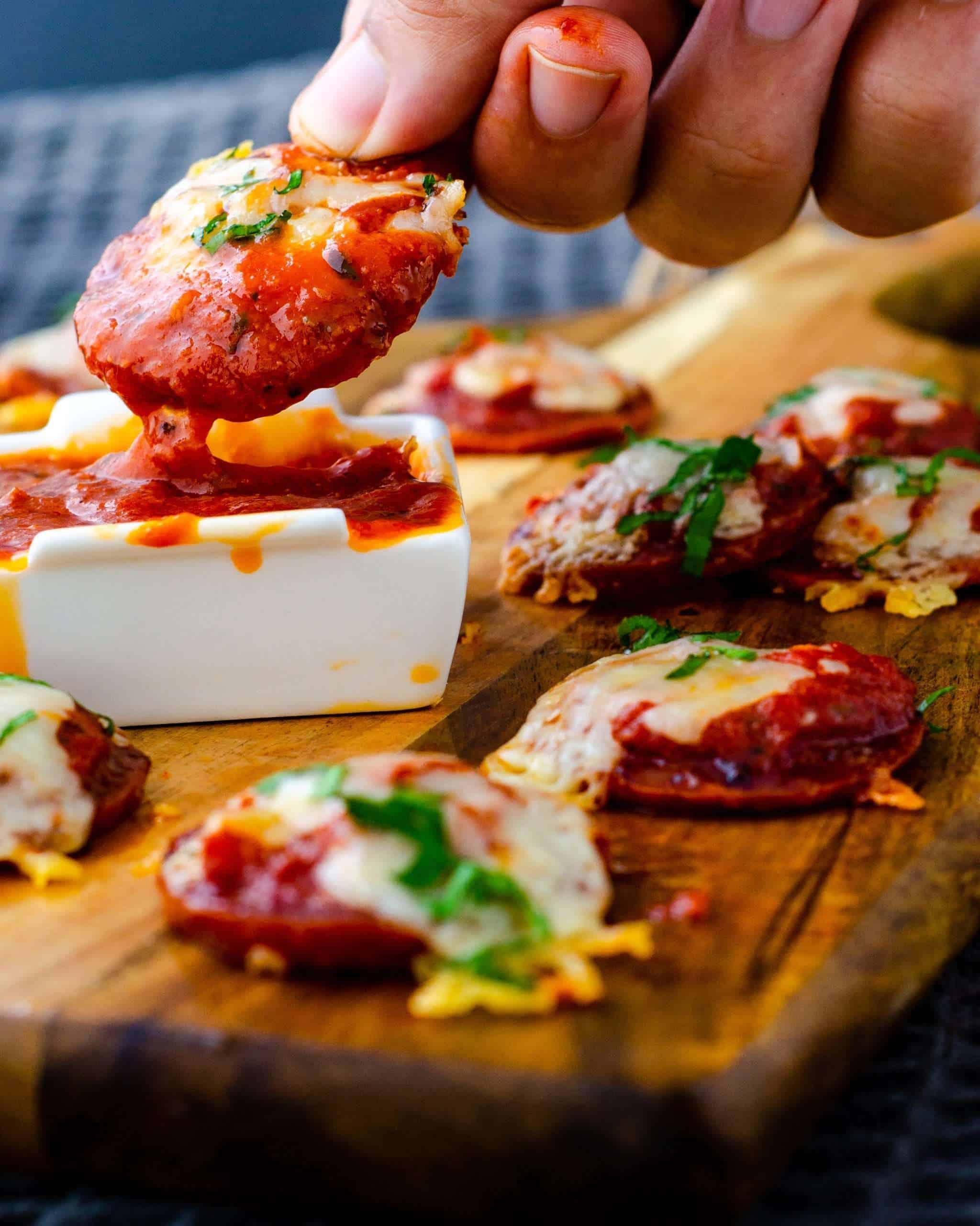 Low Carb Mini Pizzas dipped in pizza sauce