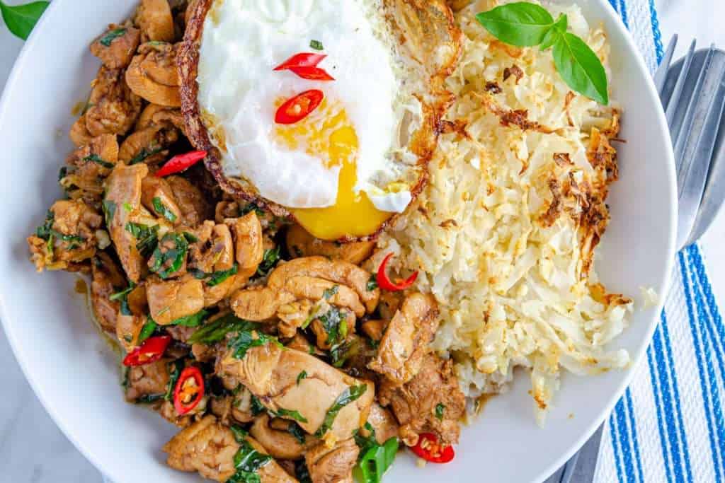 Easy low carb Thai basil chicken in a white bowl