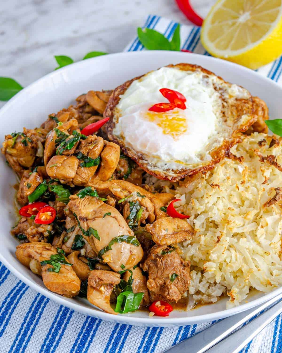 A bowlful os low carb Thai basil chicken with sides