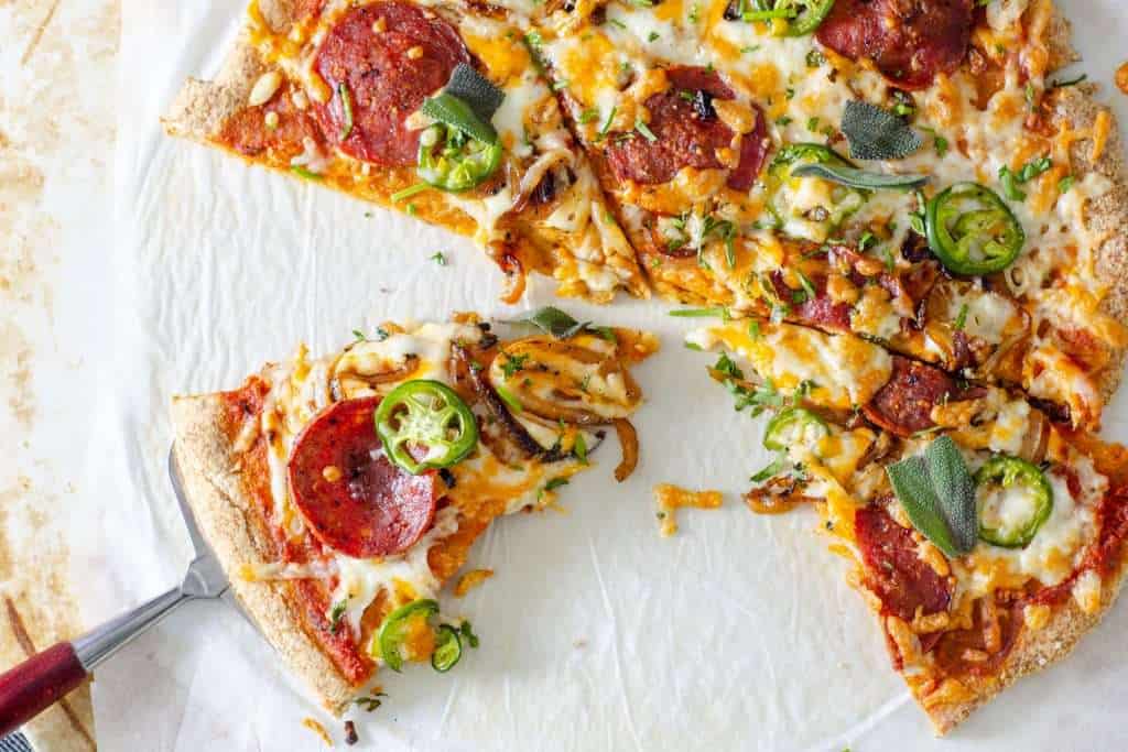 Low Carb Pizza sliced on a stone