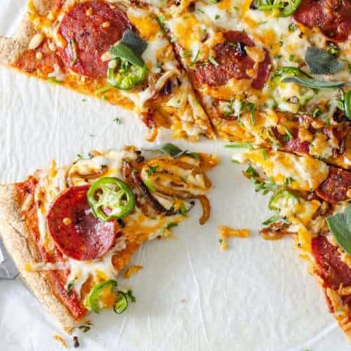 Low Carb Pizza sliced on a stone