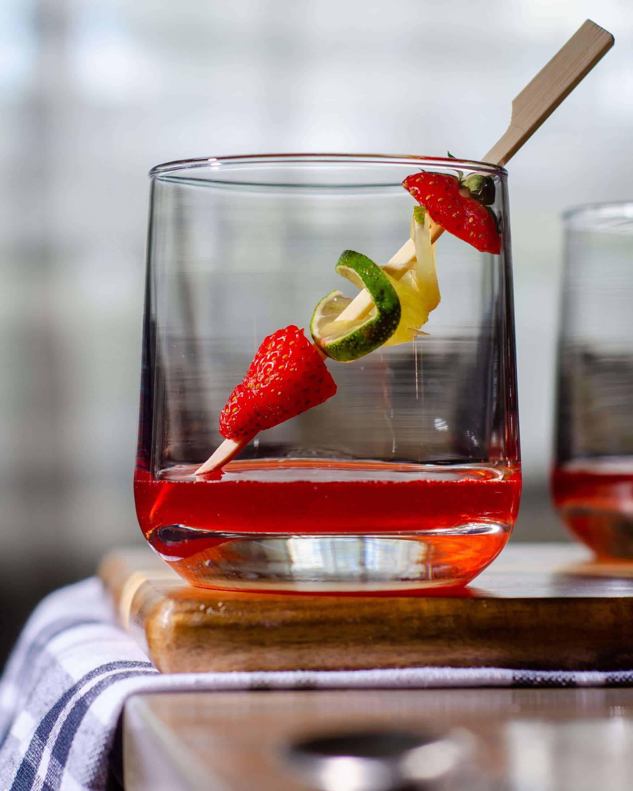 Strawberry simple syrup in a glass