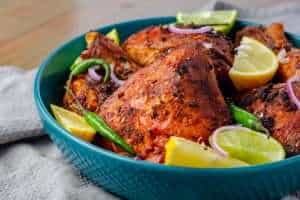 A platter of garnished low carb peri peri chicken