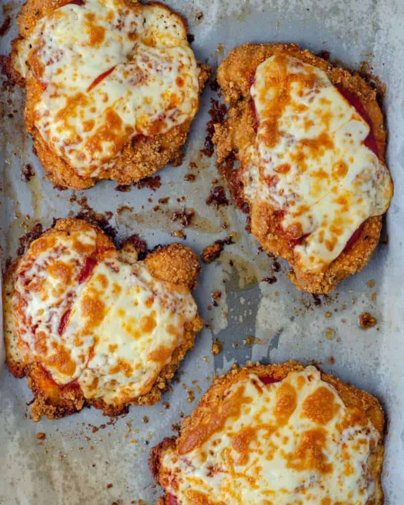 Oven Baked Chicken Parmesan on a baking tray