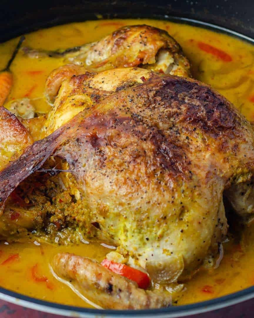 Braised whole chicken with crispy outer skin in a Thai coconut flavoured gravy
