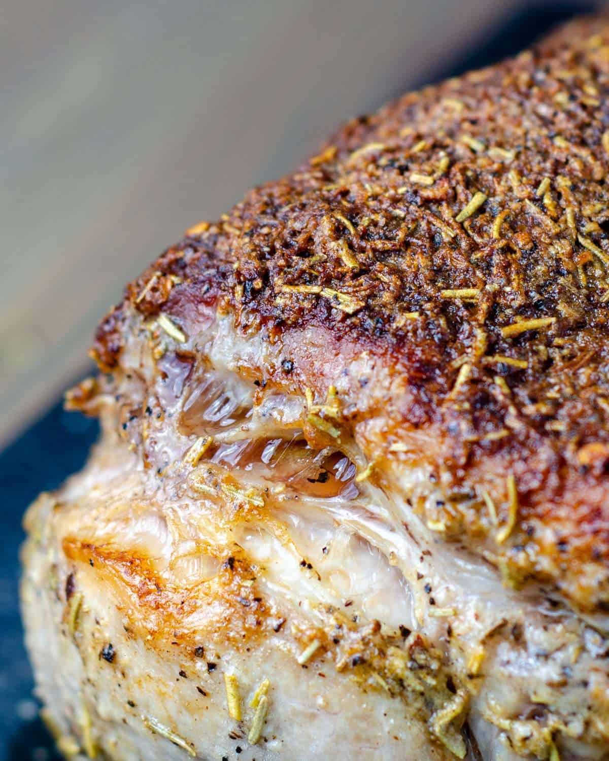 Crispy flavourful crust from the compound butter on a bone in pork rib roast