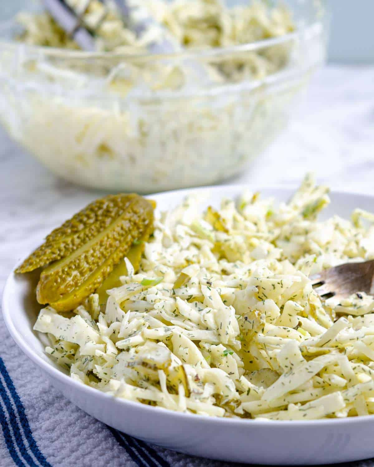 Dill pickle keto coleslaw in a bowl on a counter