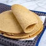 oat fiber and almond flour keto tortillas staked and folded.