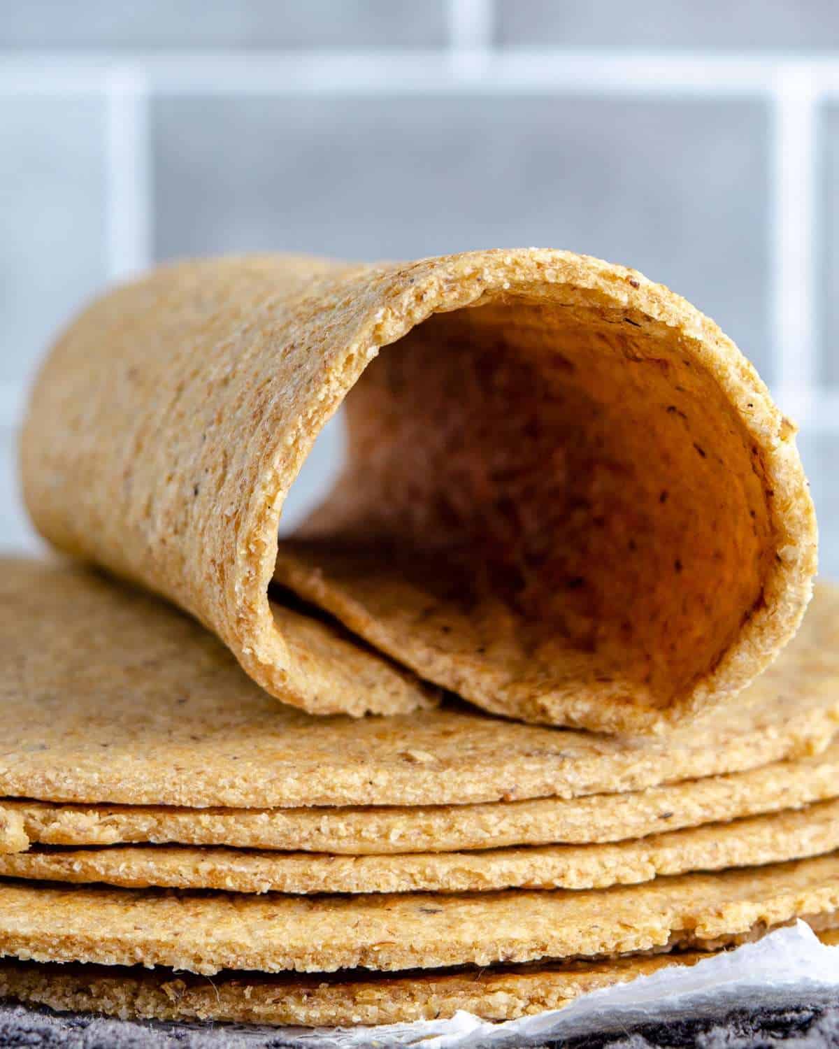 A low carb oat fiber tortilla wrapped on a stack