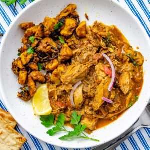 Balti turkey Curry in a bowl with celeriac bhaji