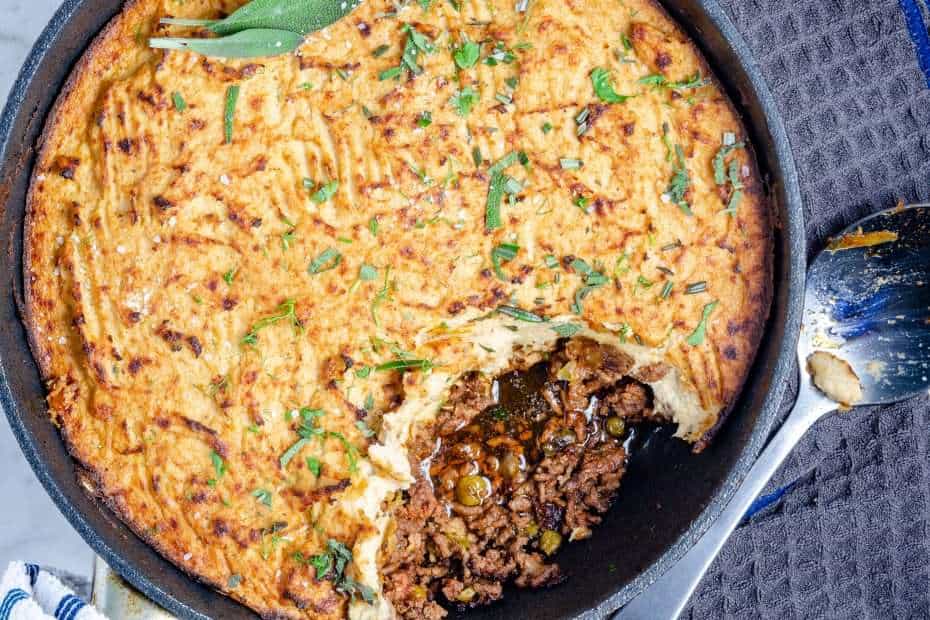 Keto Shepherd's Pie in a pan with a scoop out of it