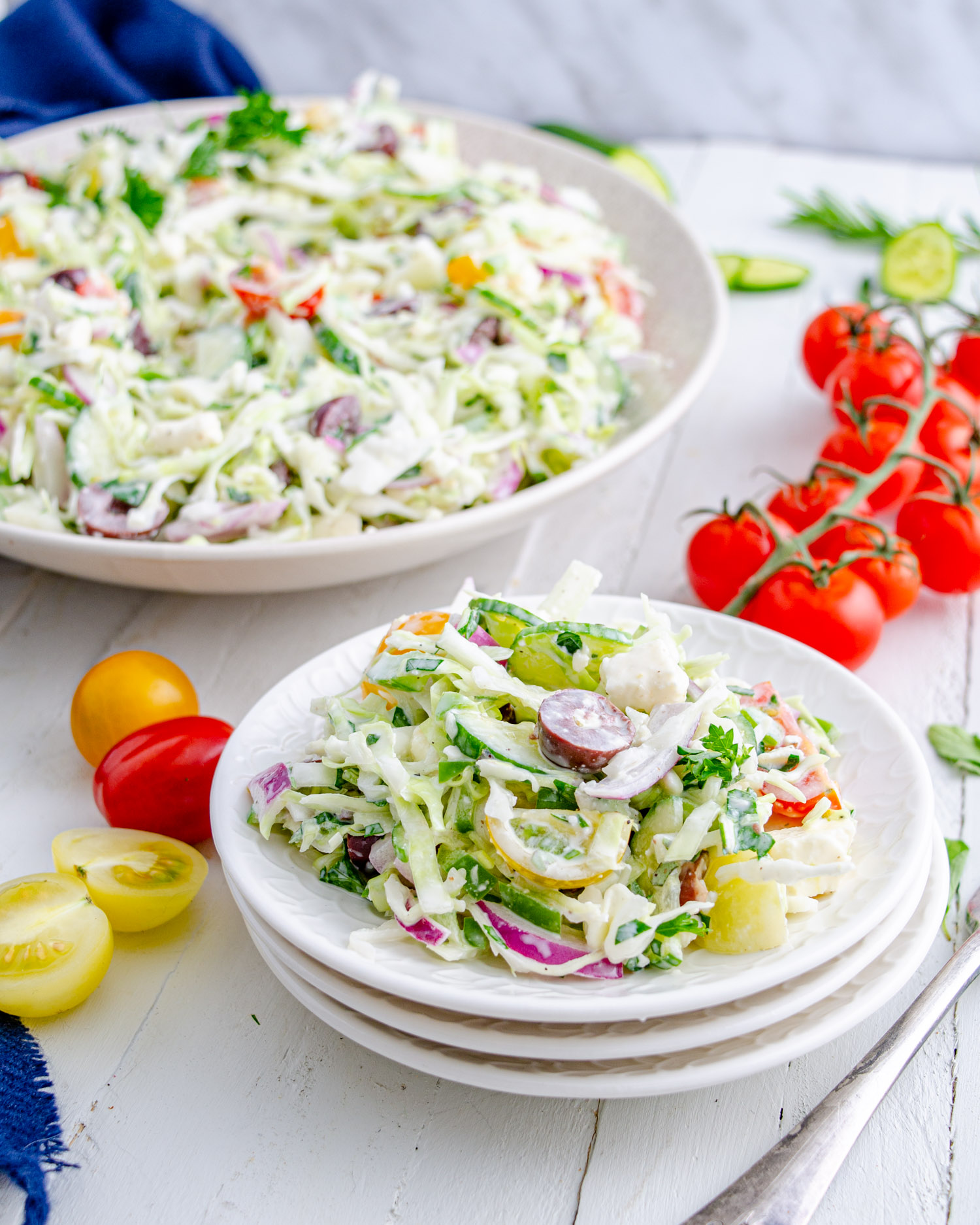 Creamy Greek style coleslaw on a white plate