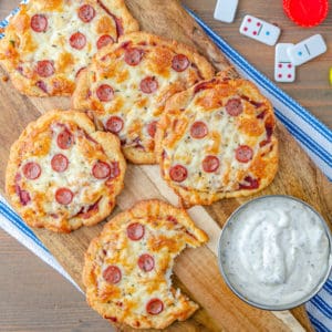Low carb mini pizzas on a cutting board for game night