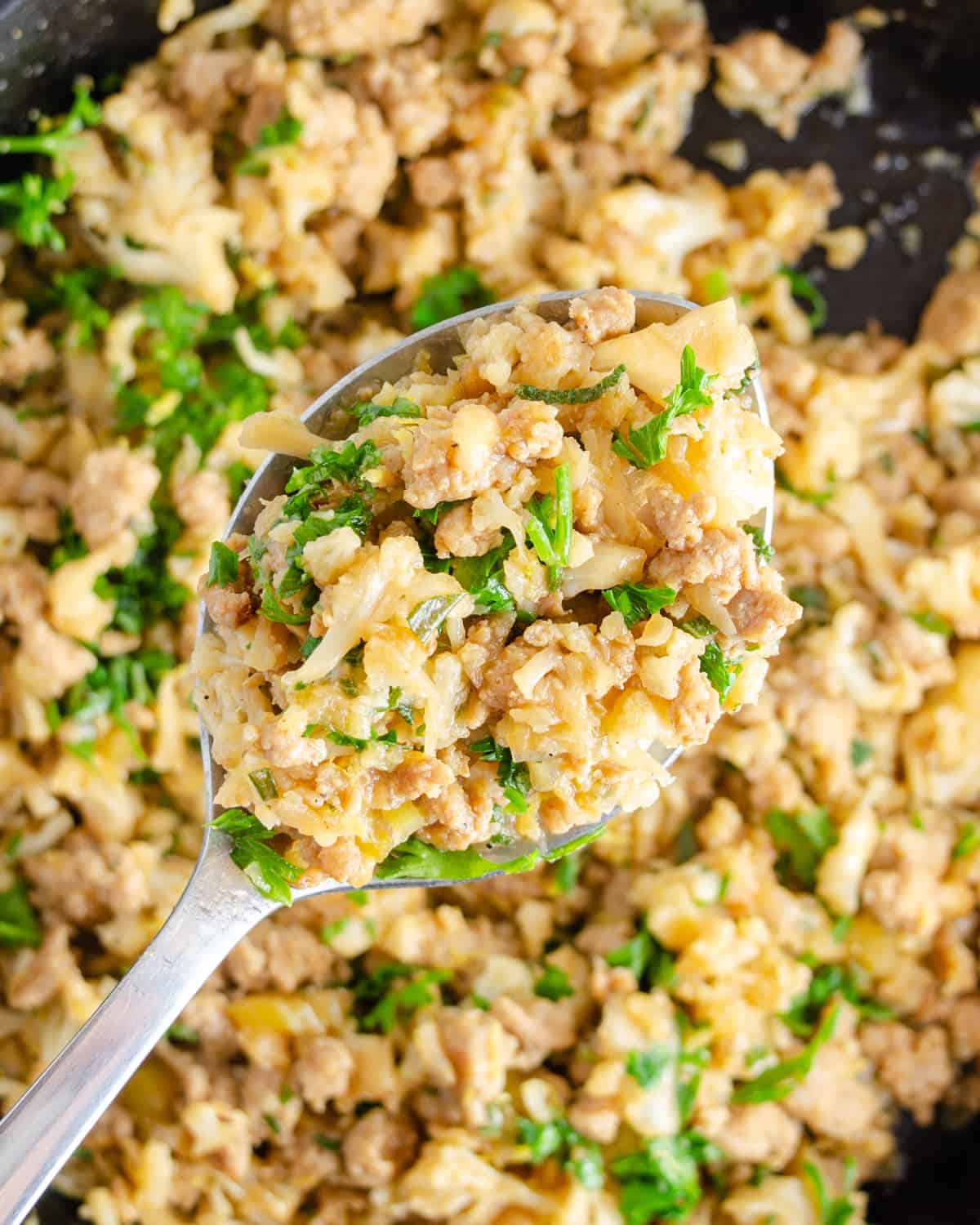 Low carb cauliflower stuffing on a spoon