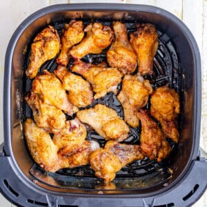 Golden brown fried chicken wings in the air fryer.
