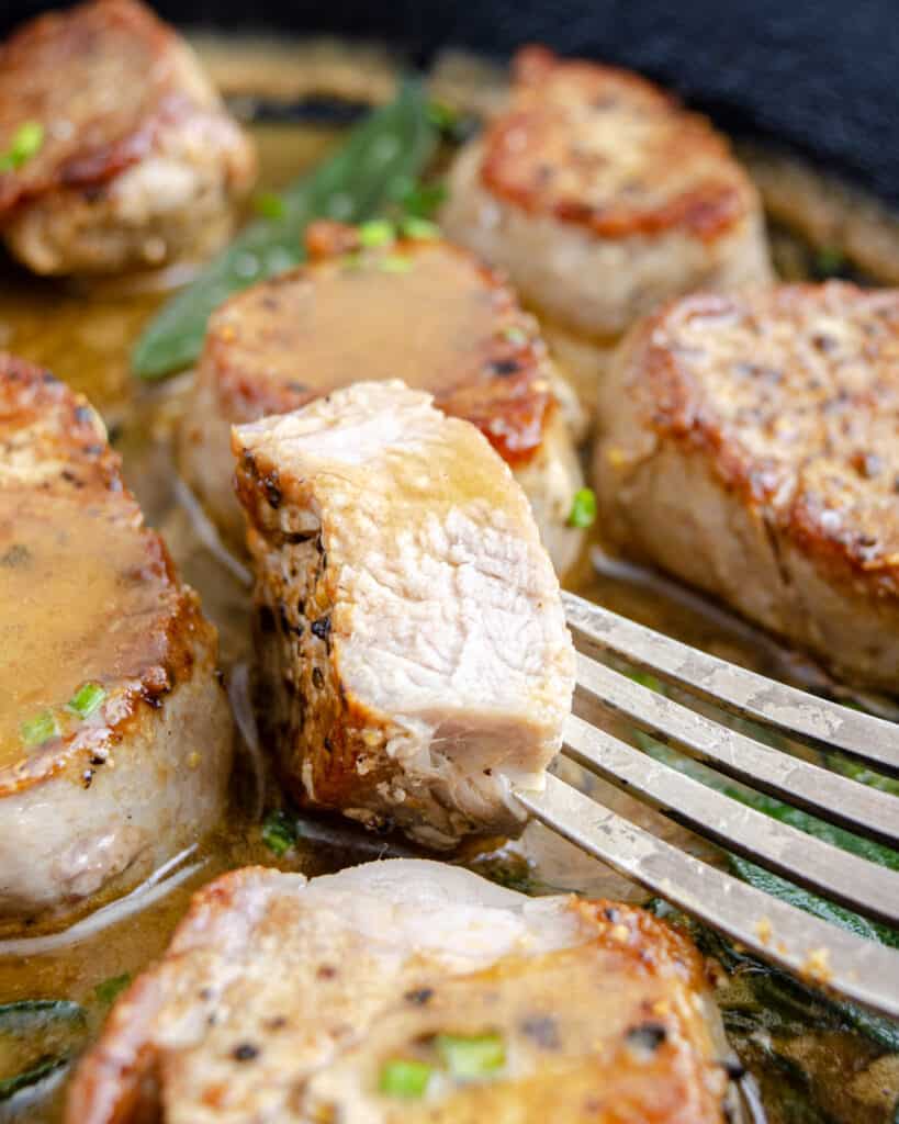 Sliced pan seared pork medallions with brown butter gravy.